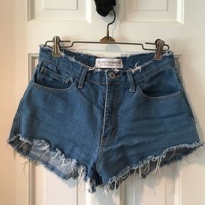 Medium rise dark wash cutoff denim shorts